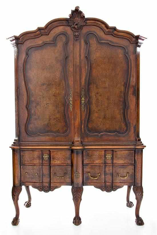 Appraisal: Continental walnut linen press on stand late th century shaped