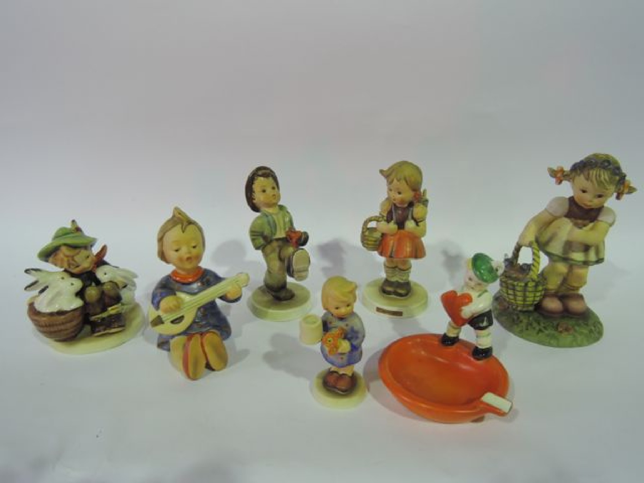 Appraisal: A collection of Goebel Hummel figures including an ashtray with