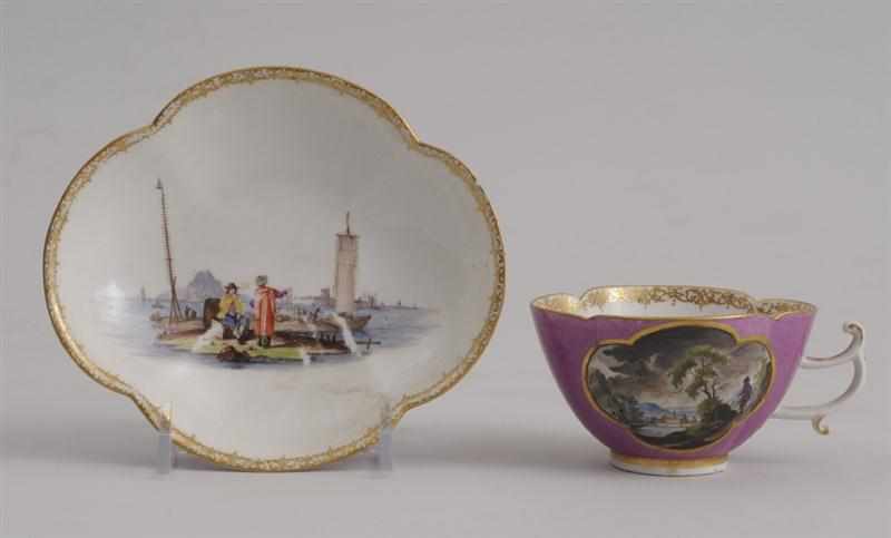 Appraisal: MEISSEN PUCE-GROUND QUATREFOIL TEACUP AND SAUCER Circa painted with landscape