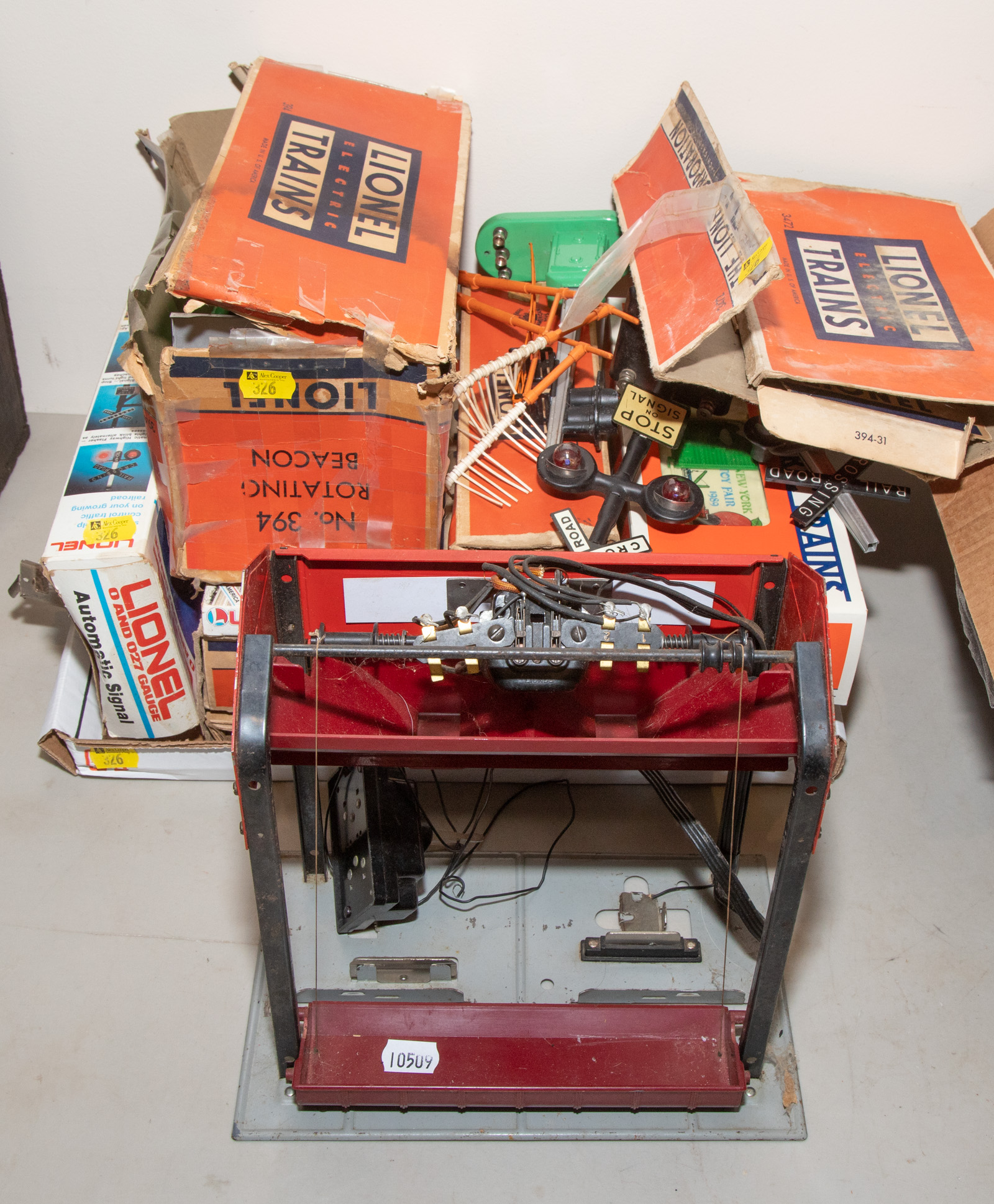 Appraisal: ASSORTED LIONEL TRAIN ACCESSORIES Includes coal bunker signs operating cattle