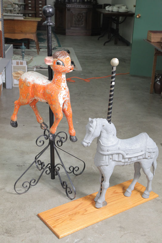 Appraisal: TWO KIDDIE CAROUSEL ANIMALS An orange painted wooden reindeer on