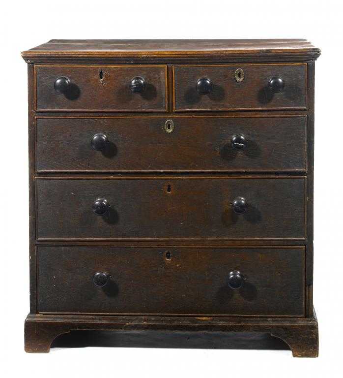 Appraisal: A GEORGE III OAK CHEST OF DRAWERS with two short