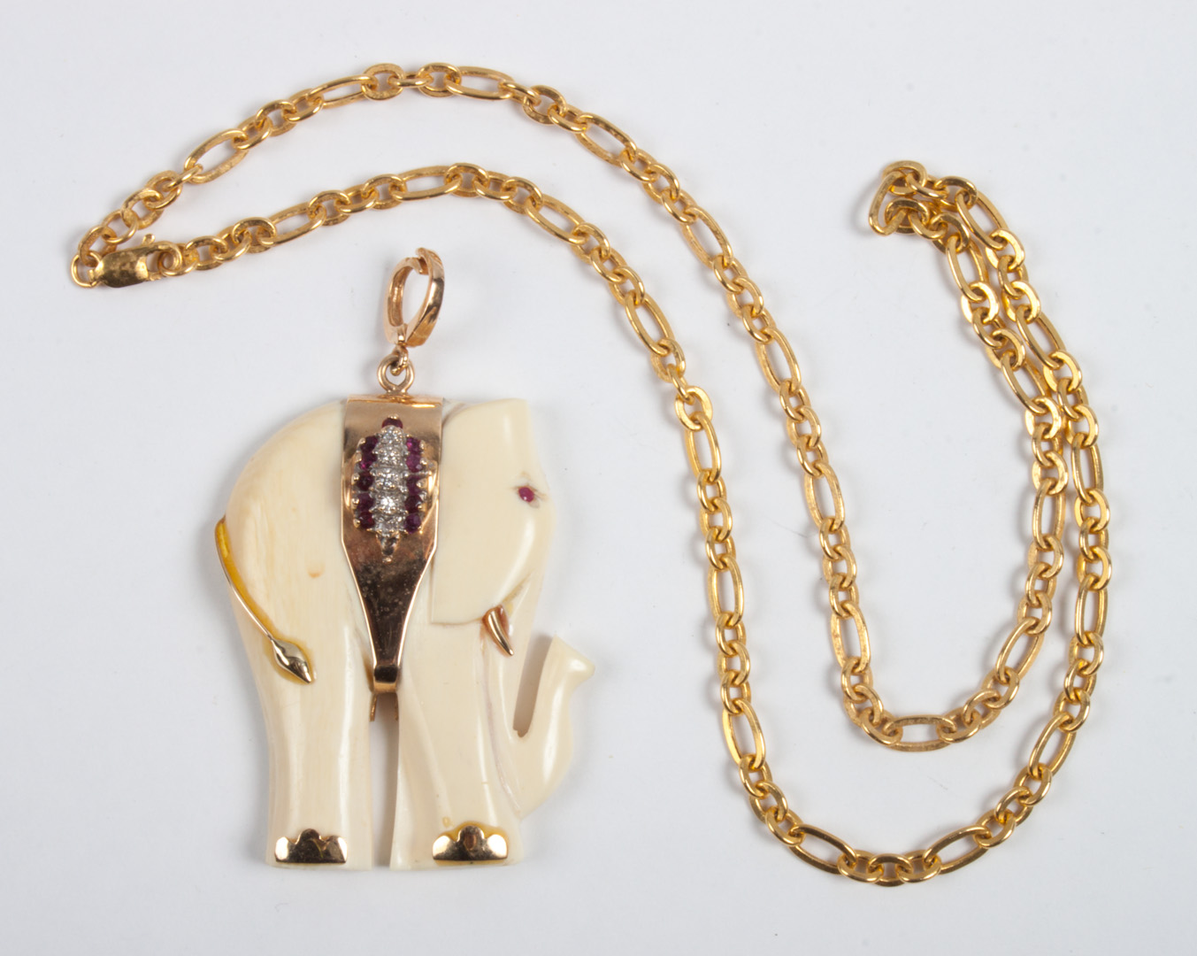 Appraisal: Gold and ivory elephant pendant necklace tests as K gold