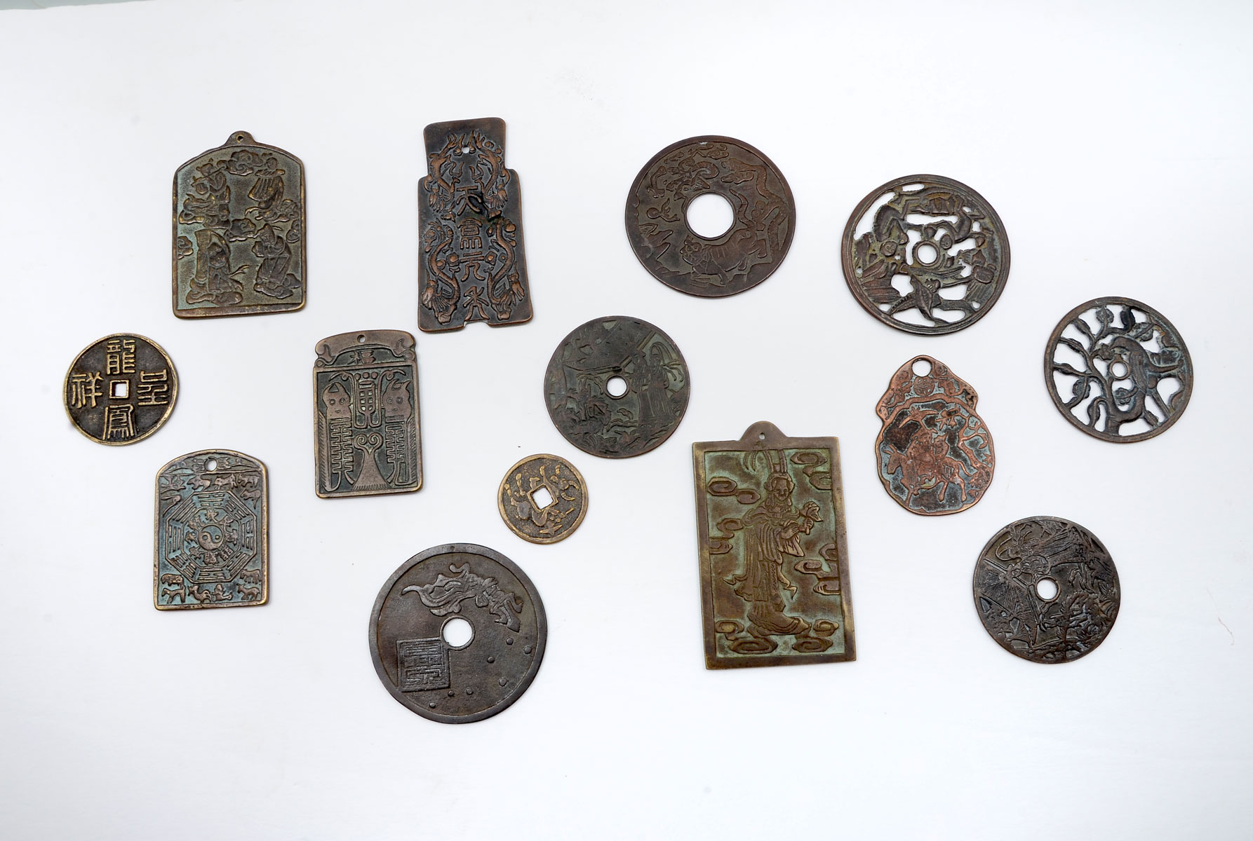 Appraisal: CHINESE BRONZE BRASS NUMERISTIC CHARMS Comprising Openwork Money Spade Charm