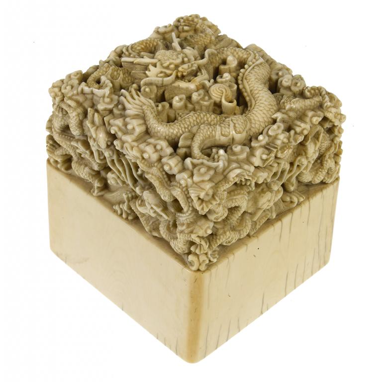 Appraisal: A CHINESE IVORY SEAL the upper part of the square