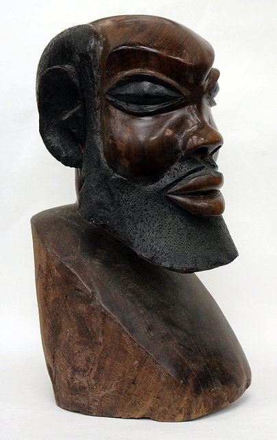 Appraisal: AN IRONWOOD SCULPTURE OF A MALE BUST purchased from the