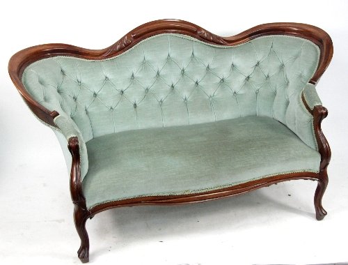 Appraisal: A Victorian style button upholstered settee with carved and moulded