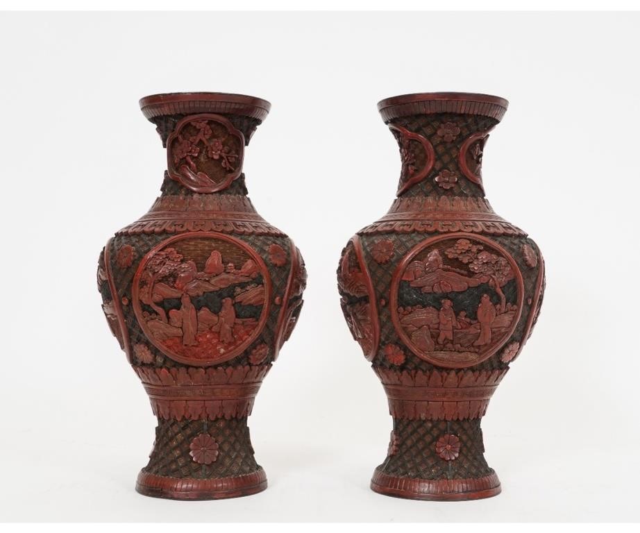 Appraisal: Pair of Chinese red cinnabar vases each decorated with landscape