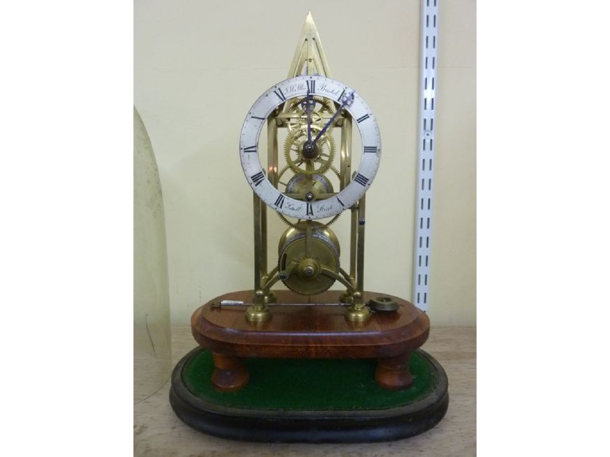 Appraisal: A skeleton clock in brass with silvered chapter ring and