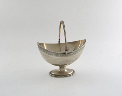 Appraisal: A George III boat-shaped sugar basket with a bright-cut frieze