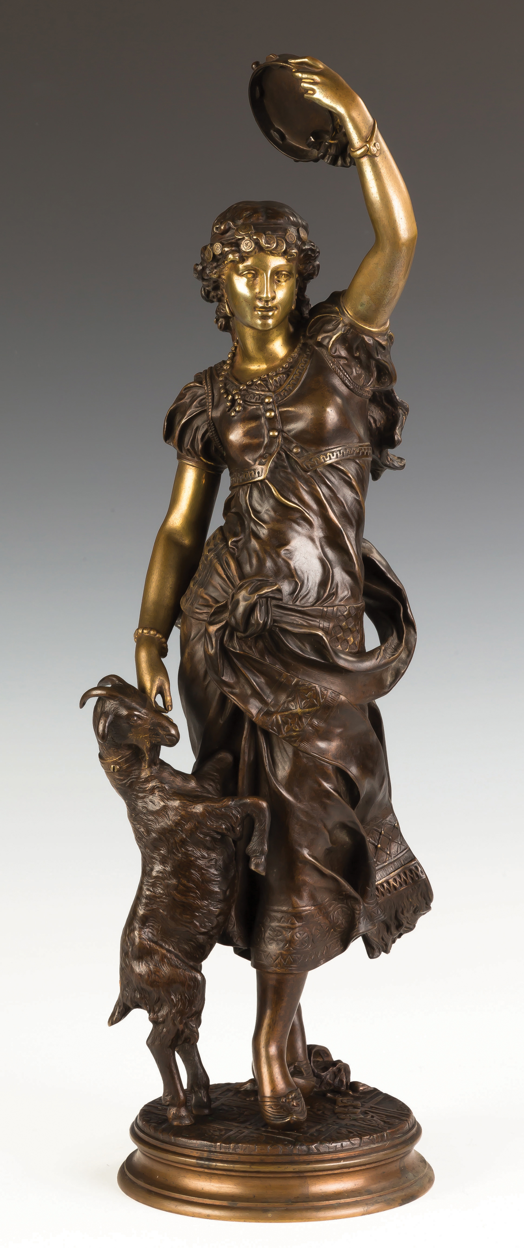 Appraisal: Bronze of a Middle Eastern Woman with Tambourine and Goat