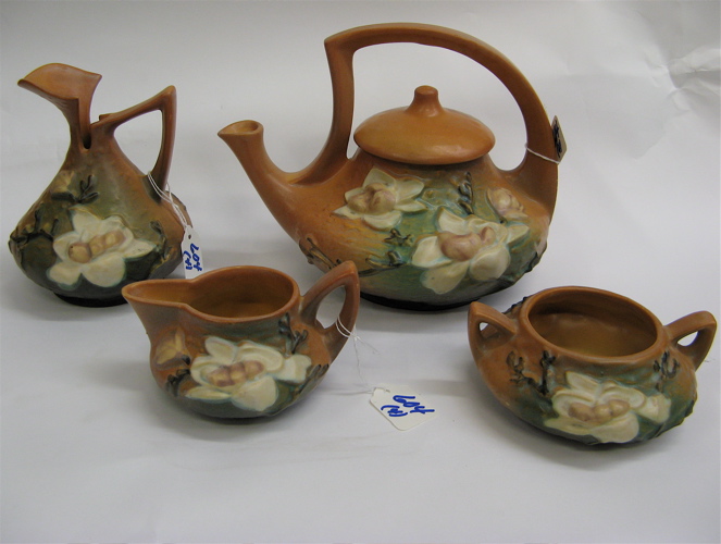 Appraisal: ROSEVILLE POTTERY FOUR PIECE TEA SET in the Magnolia pattern