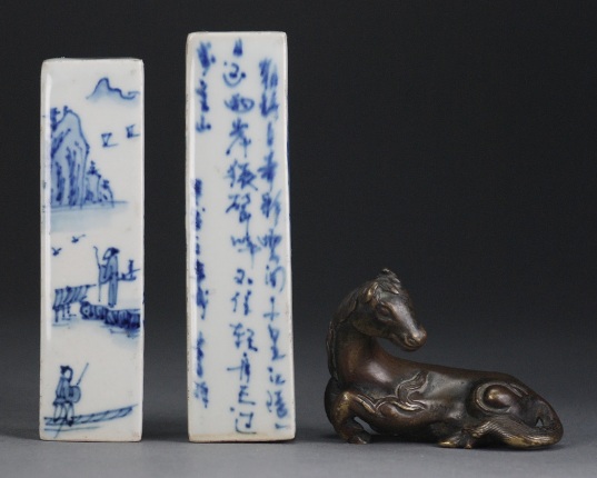 Appraisal: Each porcelain seal painted with alternating panels of landscapes and