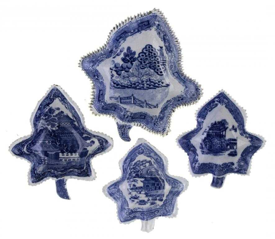 Appraisal: FOUR BLUE PRINTED EARTHENWARE PICKLE DISHES of vine leaf shape