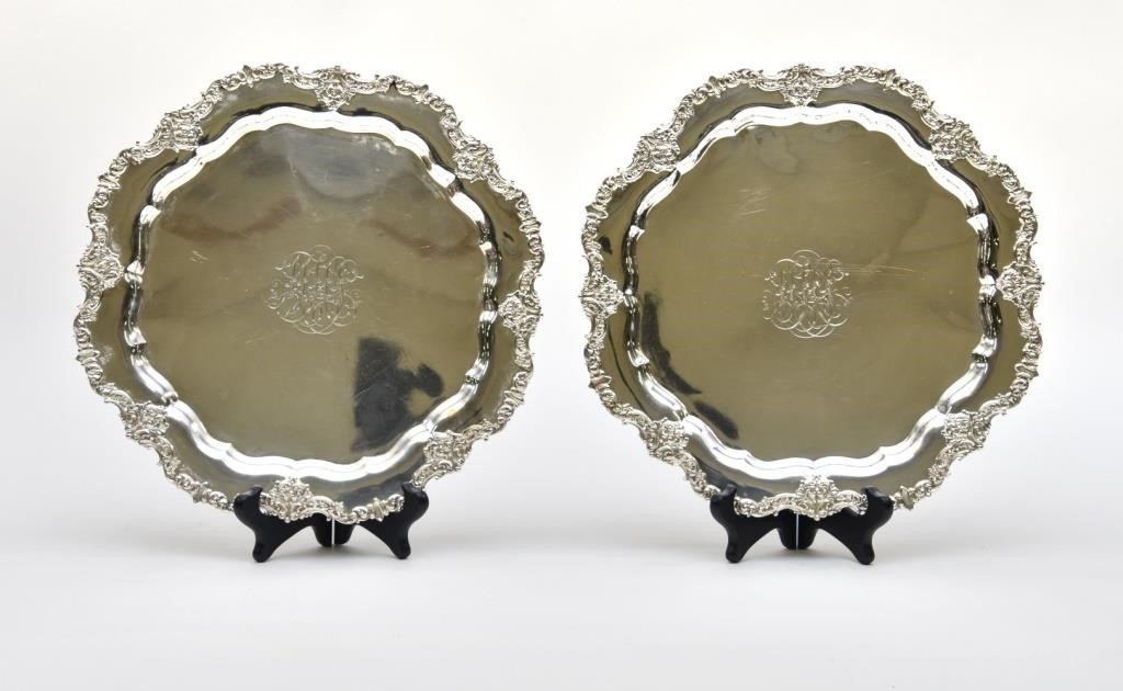 Appraisal: Two sterling silver plates with ornate rims monogrammed each dia