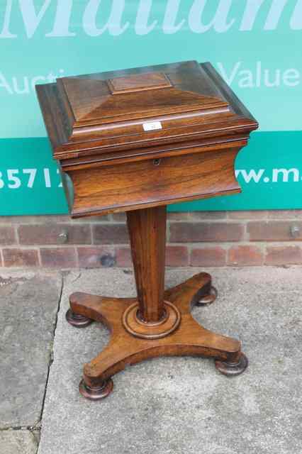 Appraisal: A VICTORIAN ROSEWOOD TEAPOY with part fitted interior and domed