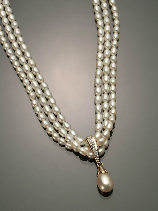 Appraisal: Baroque South Sea Pearl Necklace and Pendant Slide Each triple-strand