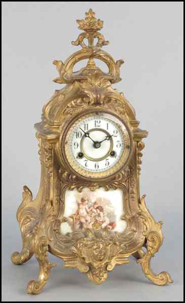 Appraisal: WATERBURY GILT BRONZE MANTLE CLOCK Bearing an inset enamelled plaque