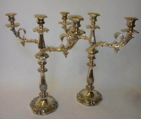 Appraisal: A PAIR OF VICTORIAN OLD SHEFFIELD PLATE CANDELABRA the bell