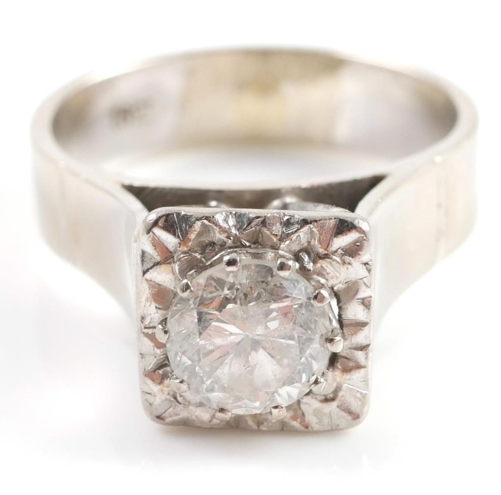 Appraisal: k white gold ring contains one round brilliant cut diamond