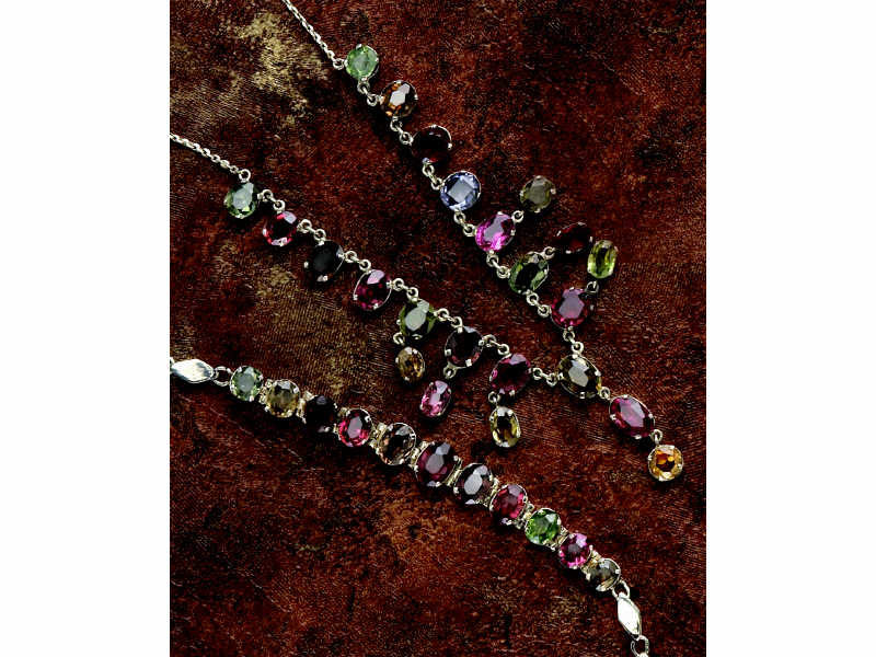 Appraisal: GEMSTONE NECKLACE AND BRACELET Silver set with oval faceted multi-color