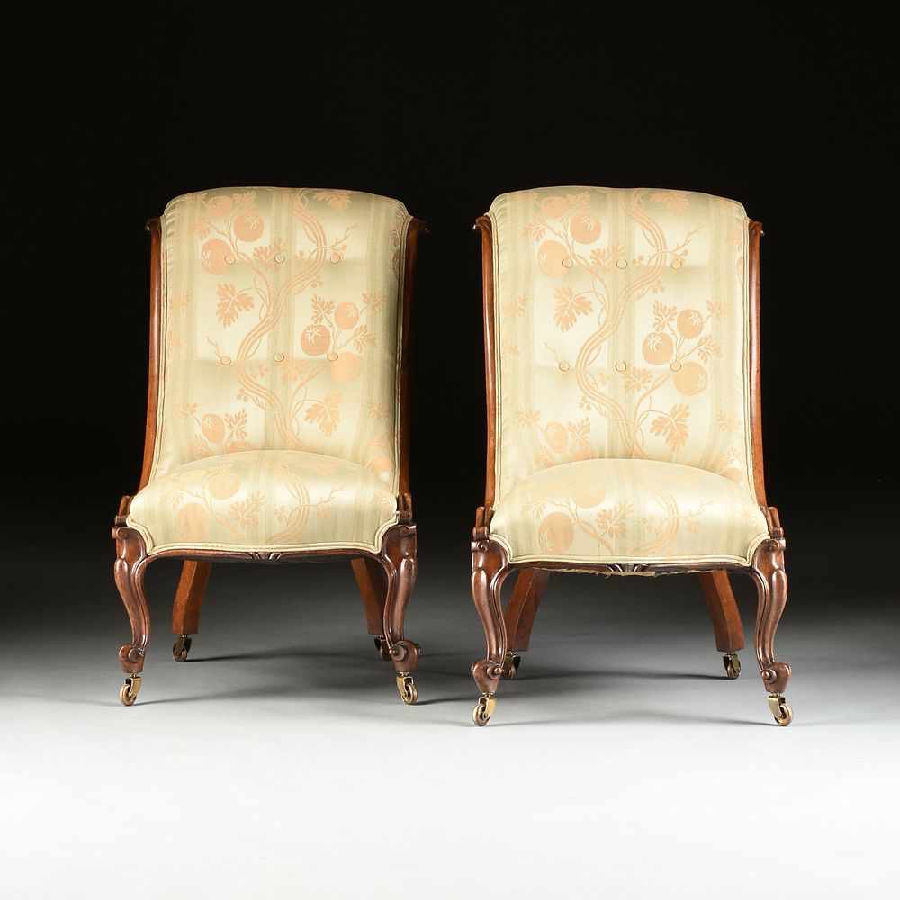 Appraisal: A PAIR OF VICTORIAN UPHOLSTERED ROSEWOOD TALL BACK SLIPPER CHAIRS