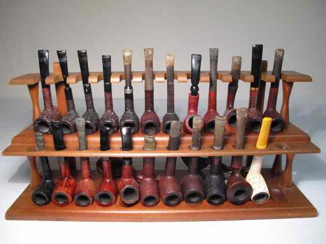 Appraisal: Fine tobacco smoking pipe collection stand and accessories Includes total