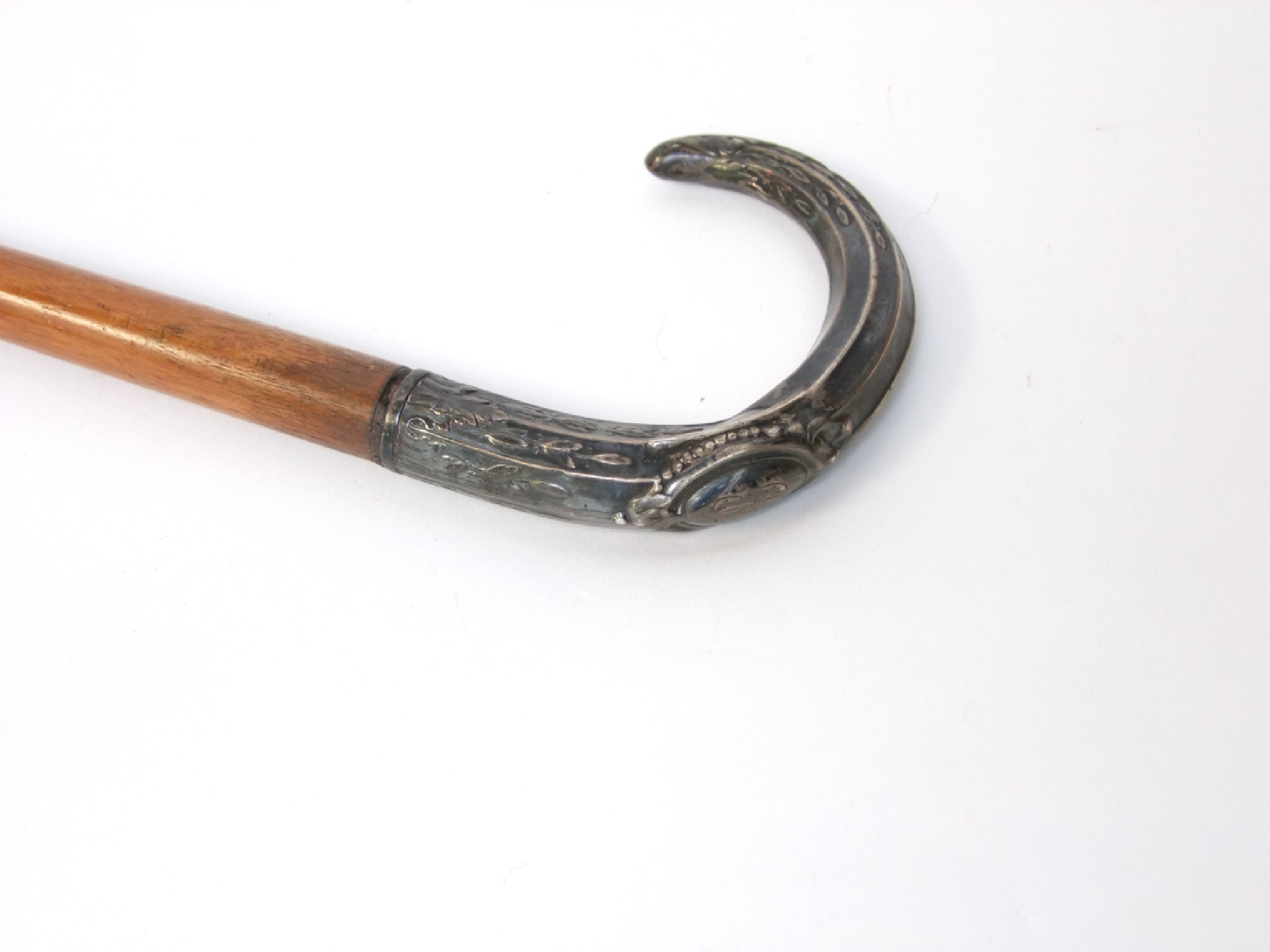 Appraisal: An antique timber walking cane terminating in a crooked handle