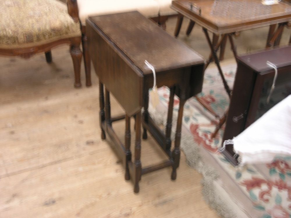 Appraisal: An oak Sutherland table 's drop leaves with canted corners