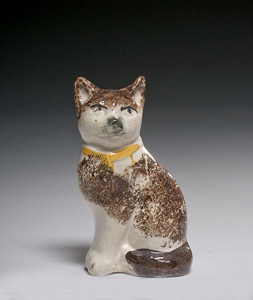 Appraisal: STAFFORDSHIRE SEATED CAT FIGURE British th century of sponge decorated