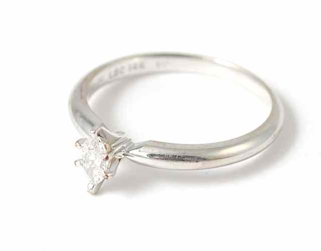 Appraisal: DIAMOND AND FOURTEEN KARAT WHITE GOLD SOLITAIRE RING featuring a