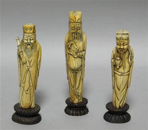 Appraisal: THREE CHINESE IVORY FIGURES OF IMMORTALS th th century each