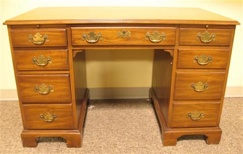 Appraisal: HENKEL-HARRIS CHERRY KNEEHOLE DESK th century the rectangular top with