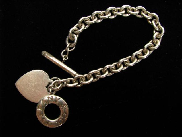 Appraisal: Tiffany Co sterling silver bracelet with heart pendant approximately ''