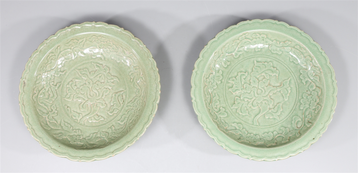 Appraisal: Pair of Chinese celadon glazed ceramic plates with molded foliate