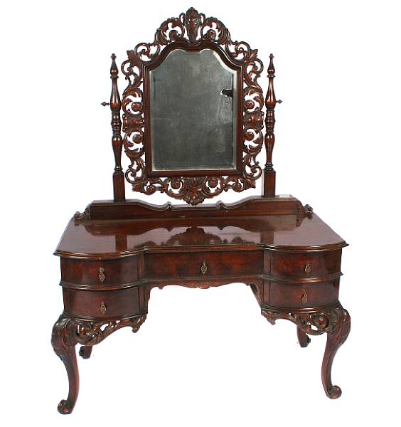 Appraisal: A Rococo Revival walnut dressing table height ft in width