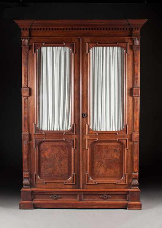 Appraisal: Victorian Renaissance Revival walnut glazed panel two-door bookcase third quarter-