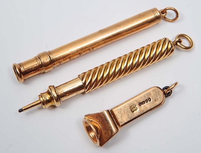 Appraisal: A ct gold cigar cuttertogether with a ct gold propelling