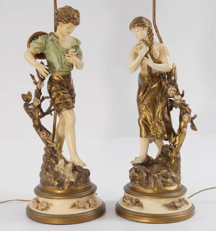 Appraisal: PAIR OF PAINTED SPELTER LAMPS AFTER MOREAU French style figure