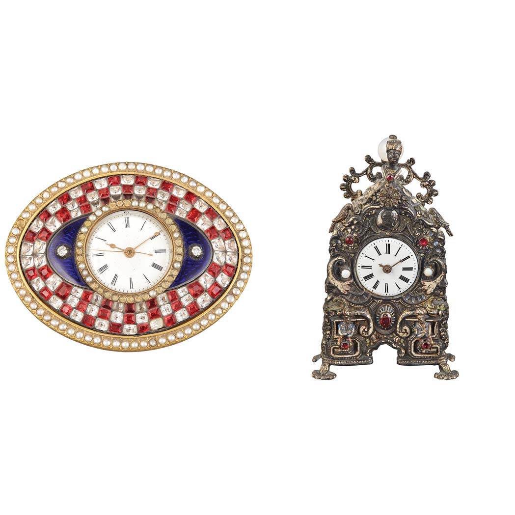 Appraisal: Two Enameled Metal Desk Clocks Comprising an oval example with