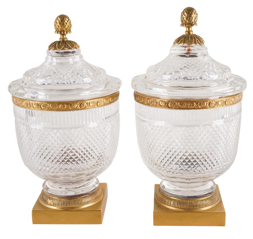 Appraisal: PAIR OF CUT-GLASS CACHEPOTSunmarked with gilt metal mounts Provenance The