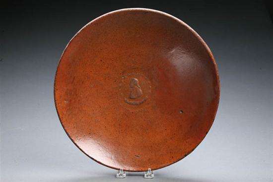 Appraisal: REDWARE CHARGER American th century Molded relief profile of Washington