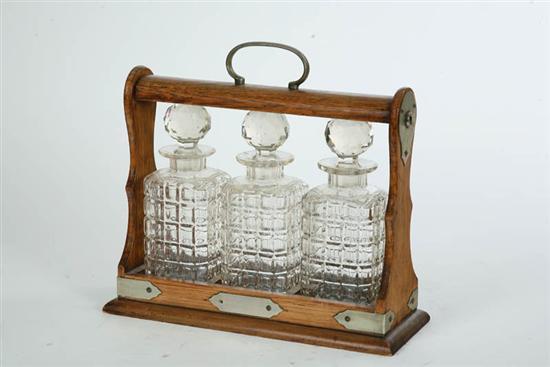 Appraisal: OAK TANTALUS With three glass decanters h w d