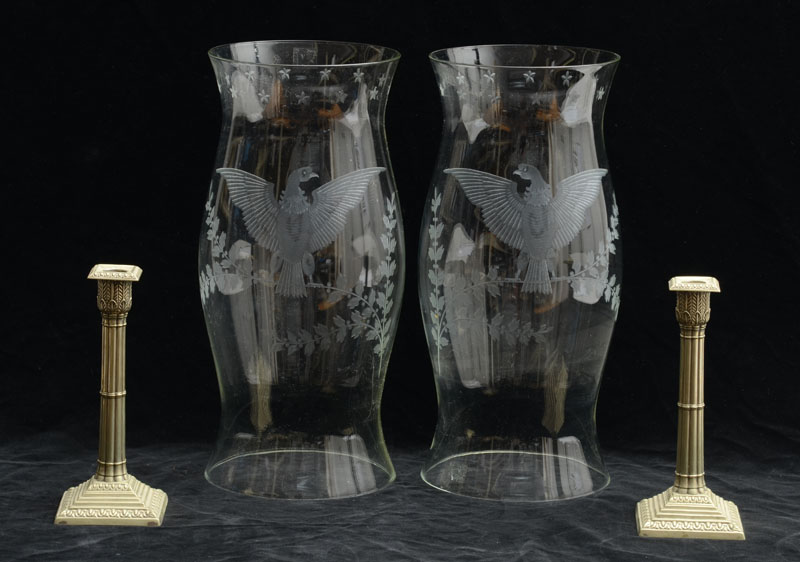 Appraisal: PAIR OF ENGRAVED GLASS HURRICANE SHADES Each with eagle perched