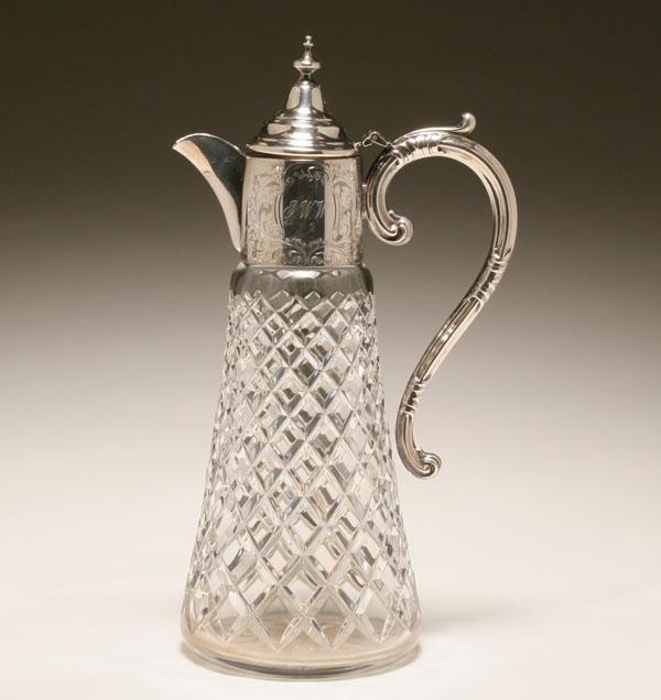 Appraisal: An English sterling mounted claret jug engraved scrolling foliate design