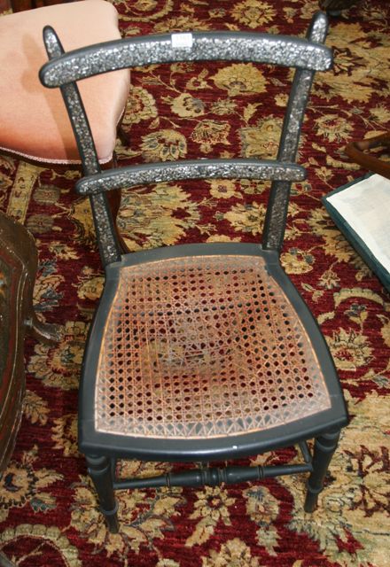 Appraisal: An Edwardian mother-of-pearl inlaid ebonised and caned occasional chair