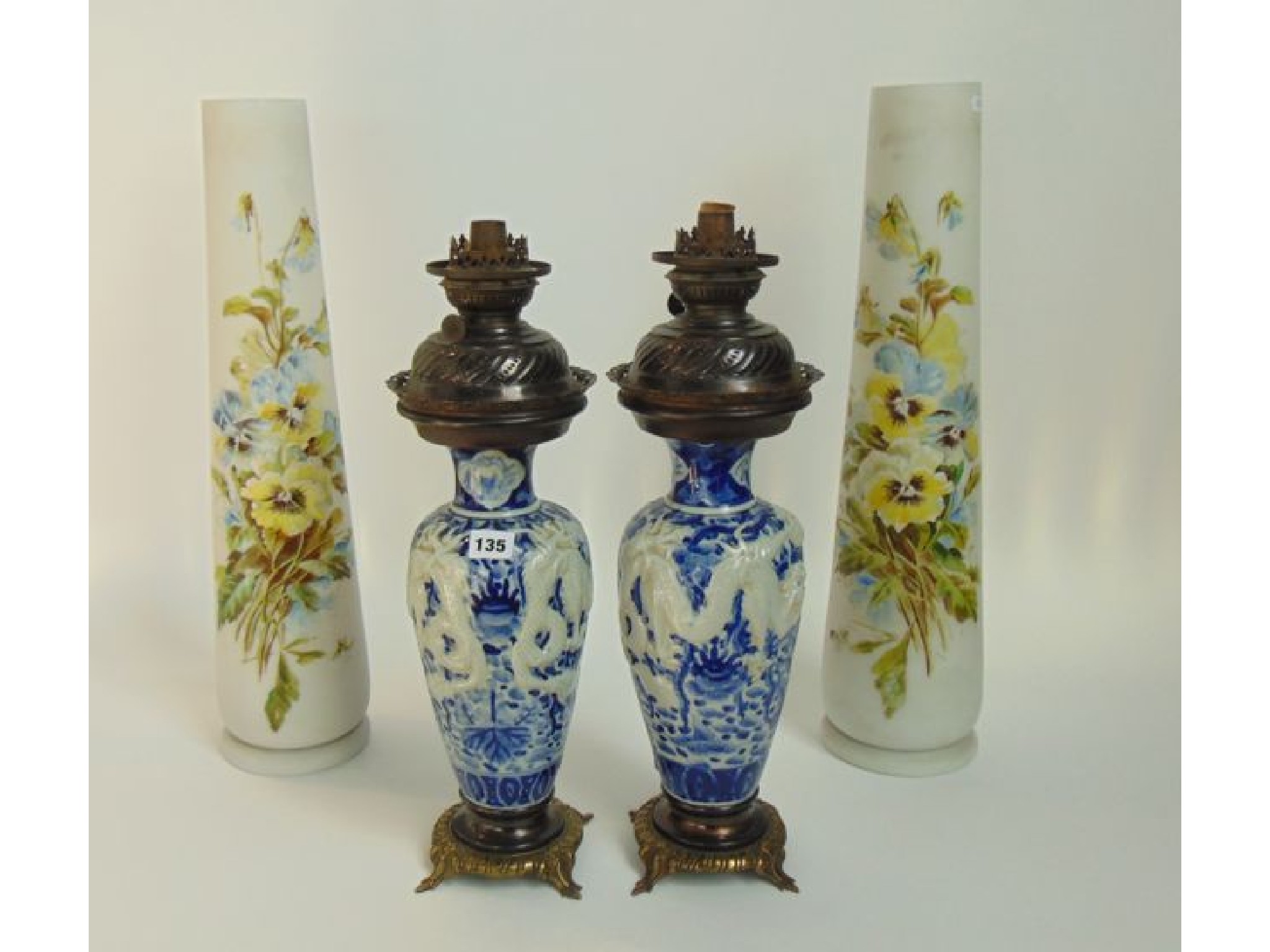 Appraisal: A pair of oil lamps with blue and white chinoisere