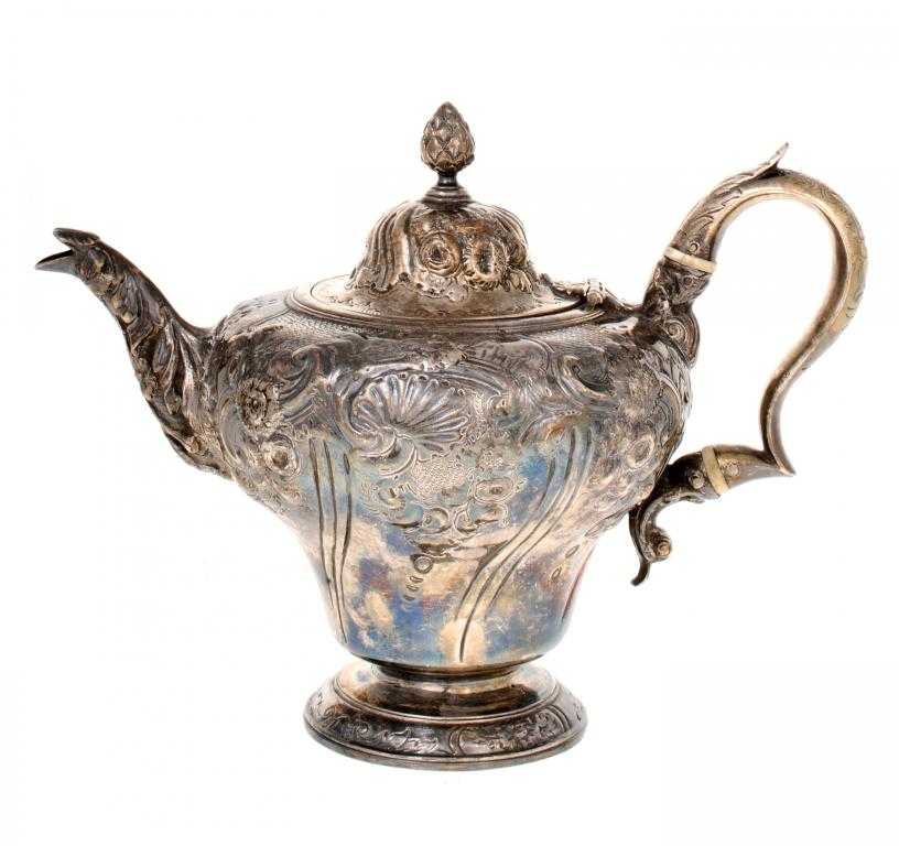 Appraisal: A VICTORIAN TEAPOT of fluted ogee shape the domed lid