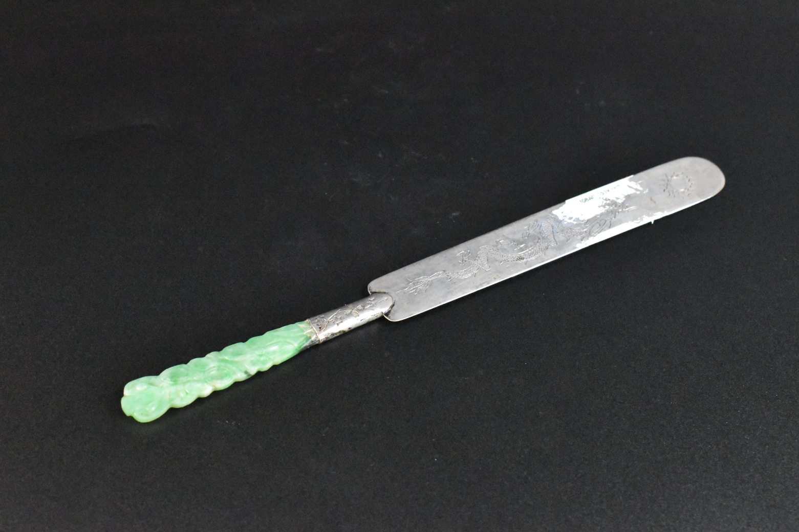 Appraisal: A Chinese jadeite handled silver letter opener A silver letter