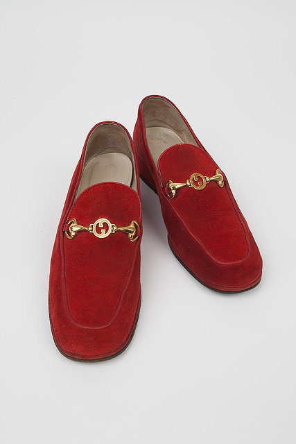 Appraisal: A pair of red suede Gucci wedge loafers with gilt